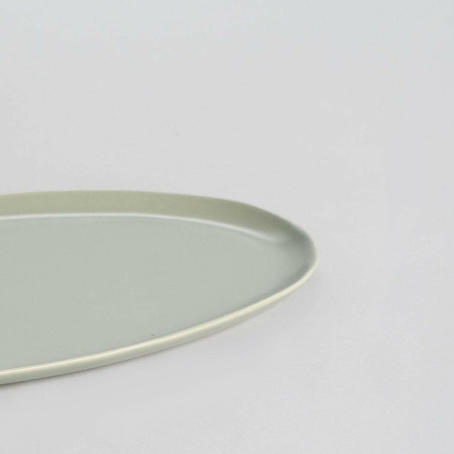 Elegant oval serving platter perfect for formal dining and stylish food presentation.