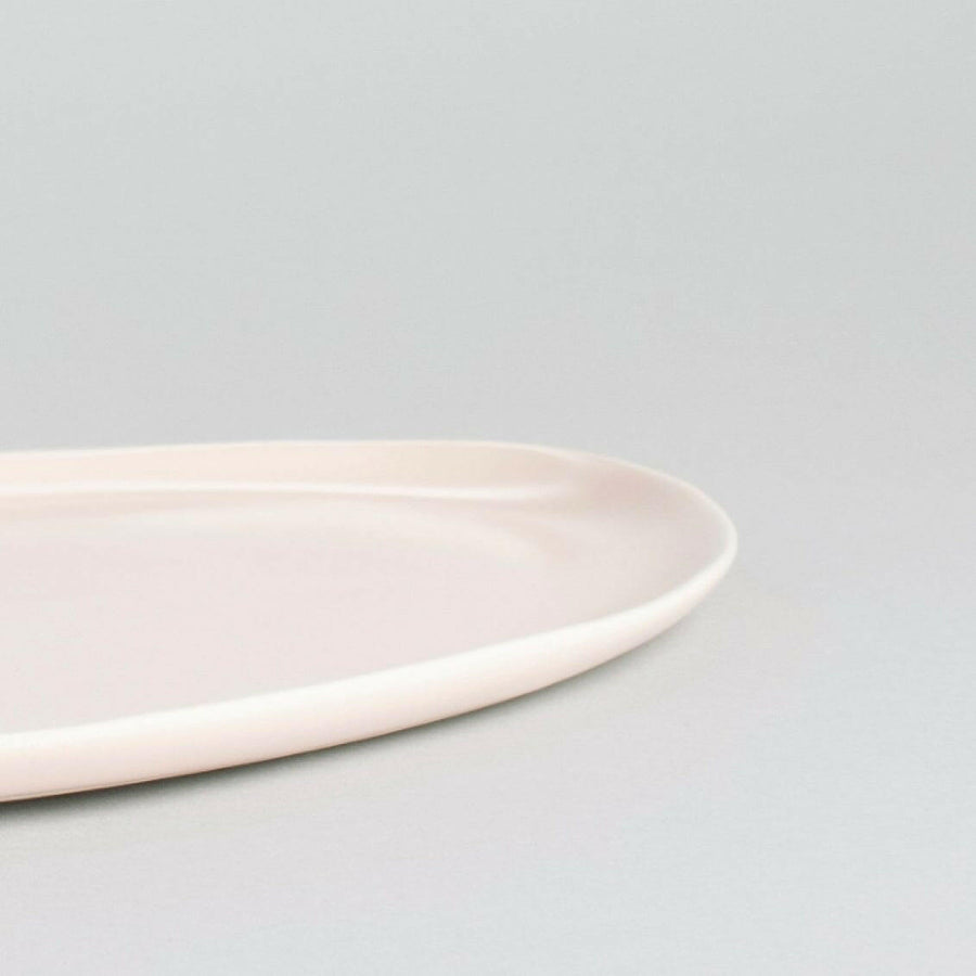 Elegant oval serving platter perfect for formal dining and stylish food presentation.