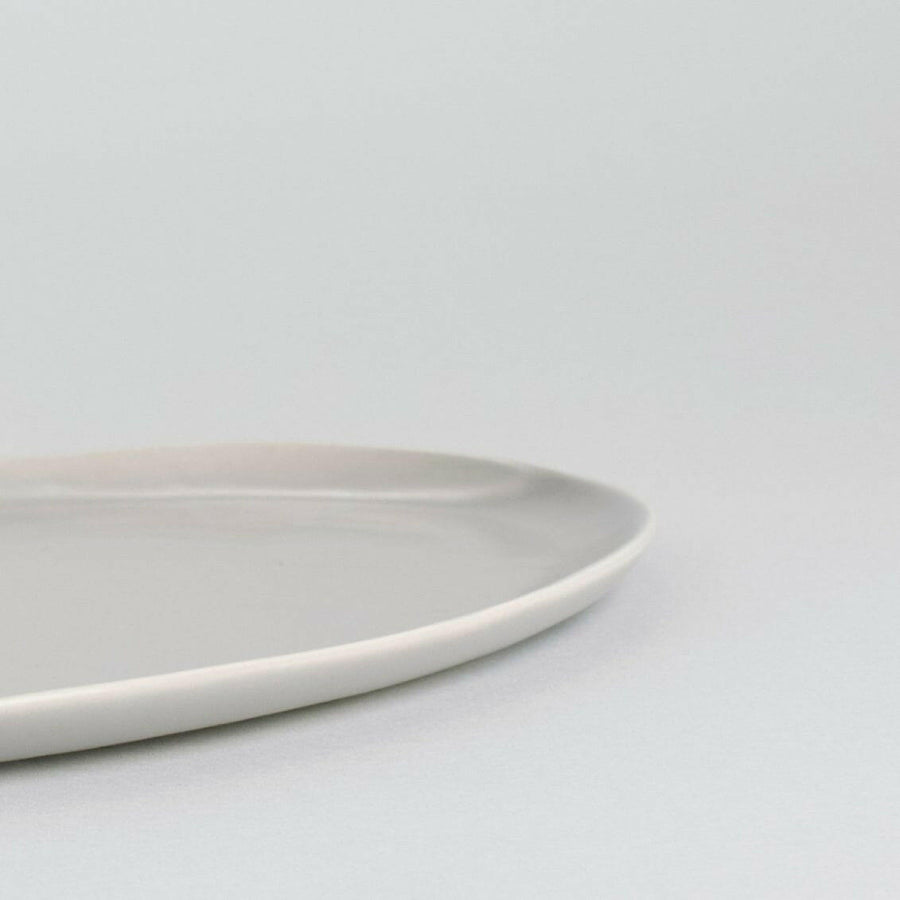 Elegant oval serving platter perfect for formal dining and stylish food presentation.