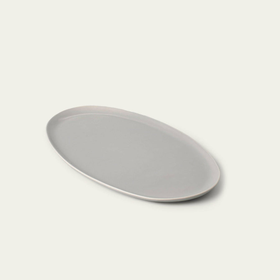 Elegant oval serving platter perfect for formal dining and stylish food presentation.