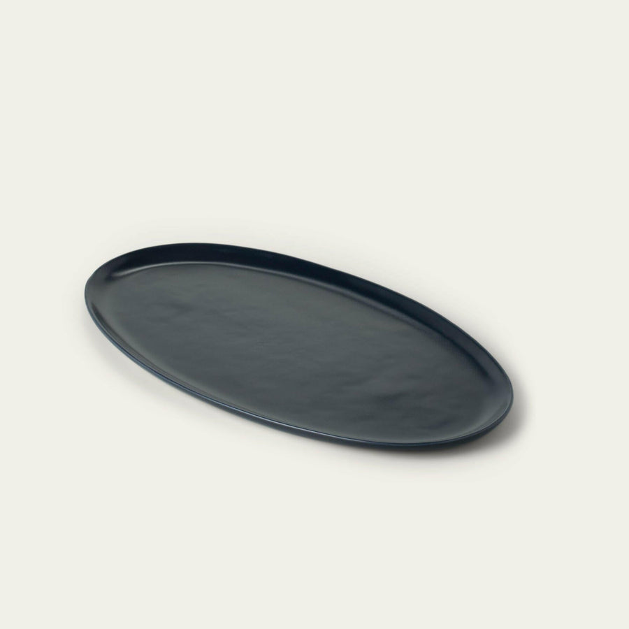 Elegant oval serving platter perfect for formal dining and stylish food presentation.