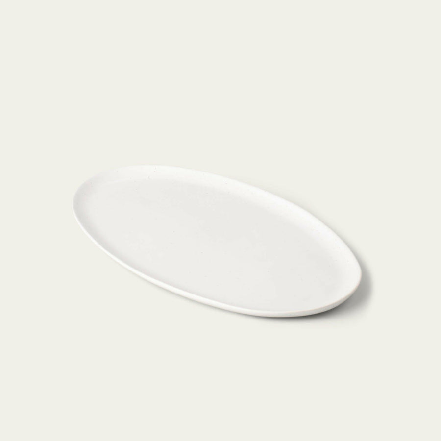 Elegant oval serving platter perfect for formal dining and stylish food presentation.