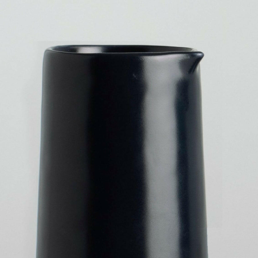 Elegant glass carafe showcasing refined craftsmanship and timeless design ideal for sophisticated dining settings.