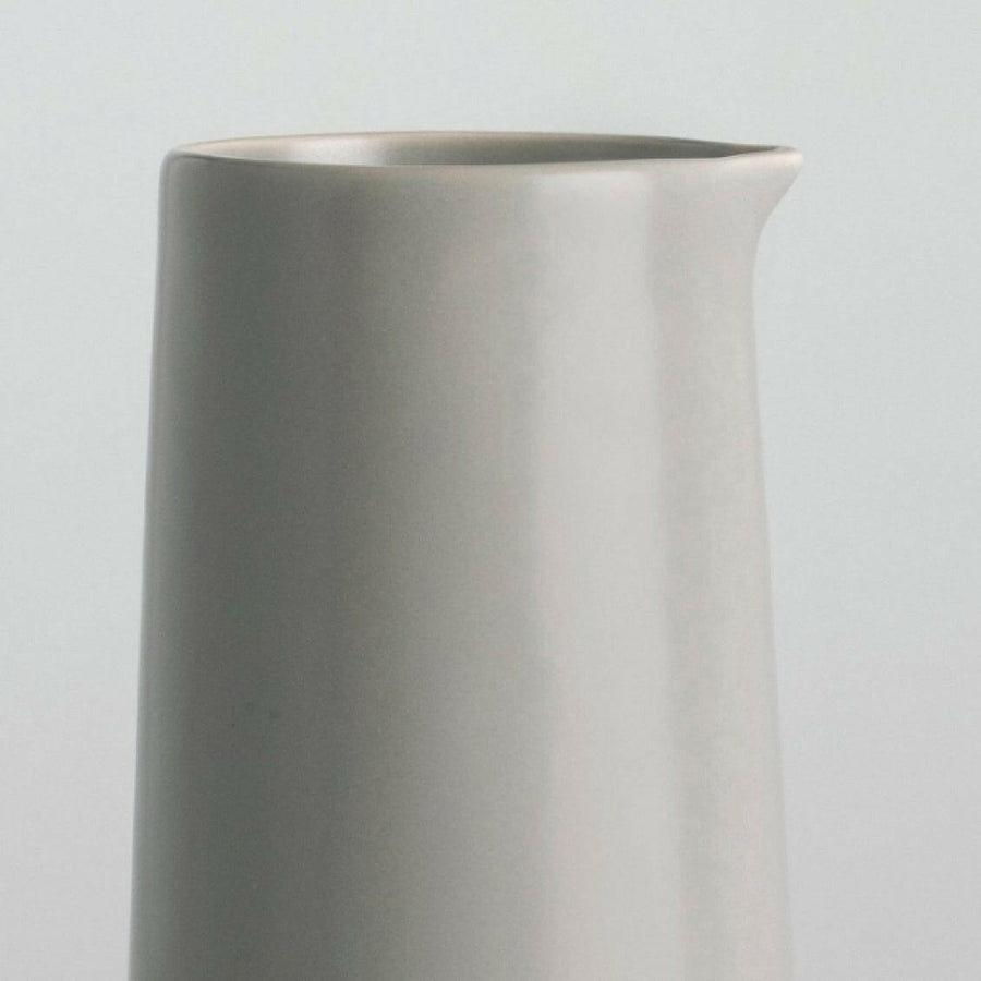 Elegant glass carafe showcasing refined craftsmanship and timeless design ideal for sophisticated dining settings.