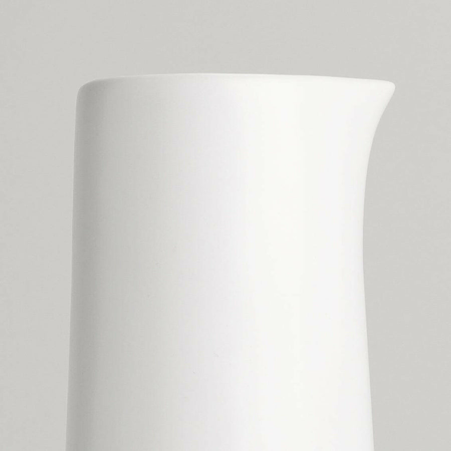 Elegant glass carafe showcasing refined craftsmanship and timeless design ideal for sophisticated dining settings.