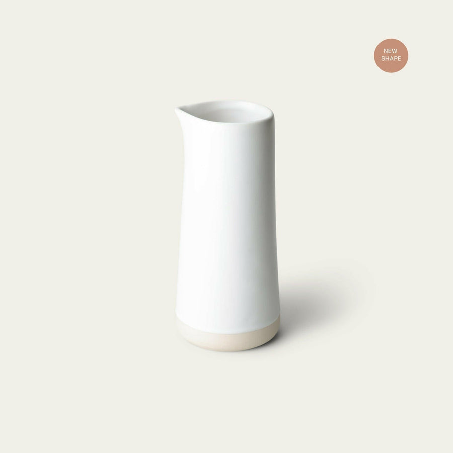 Elegant glass carafe showcasing refined craftsmanship and timeless design ideal for sophisticated dining settings.